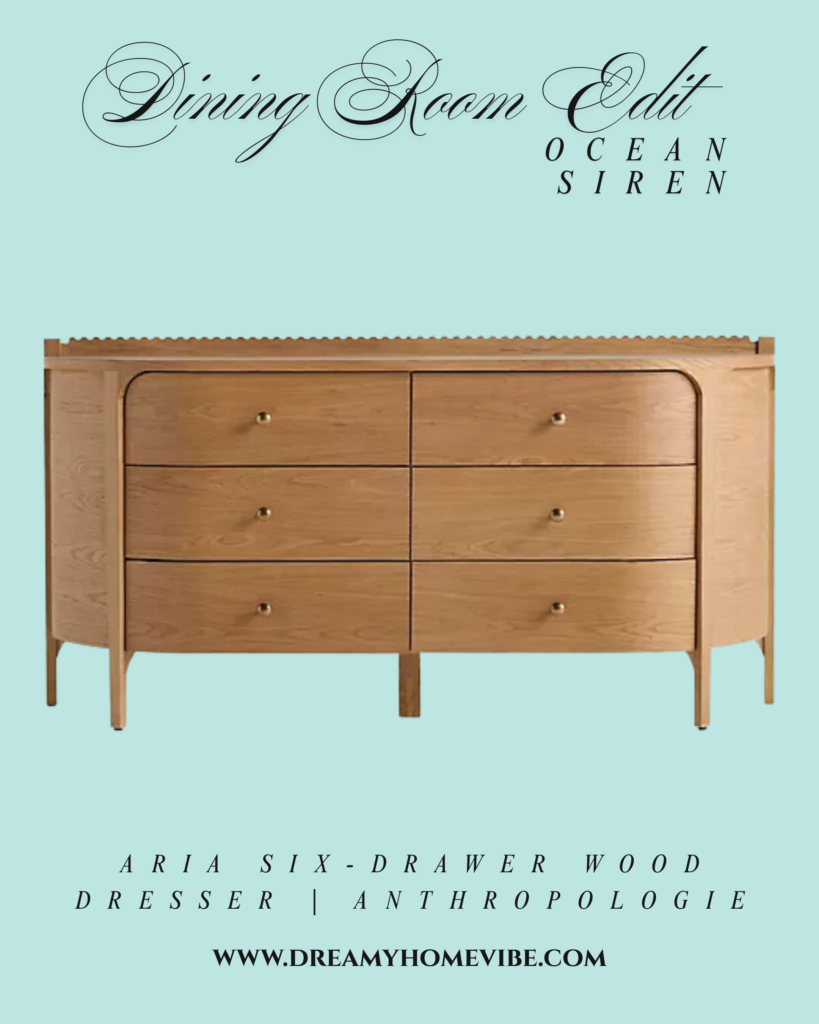 Aria Six-Drawer Wood Dresser from Anthropologie. A light-shade wooden dresser with two columns of 3 drawers. Each drawer has a round, golden knob. There are 5 legs, one on each corner and one in the center on the back. The back of the top surface is edged with a scalloped pattern.